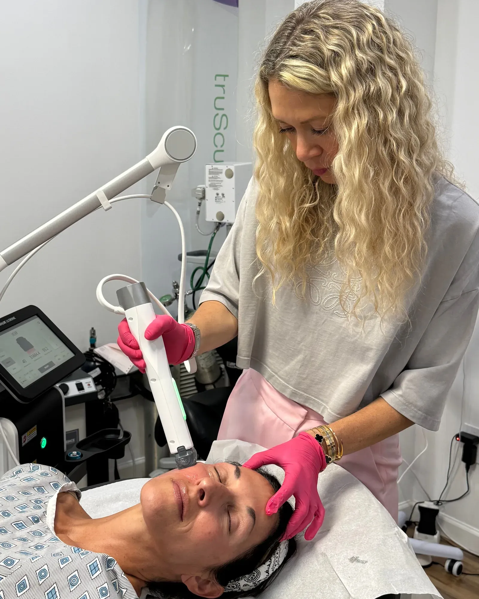 Dr. Elena Reitman performing an XERF radiofrequency skin tightening treatment at GLOW in Cresskill, NJ